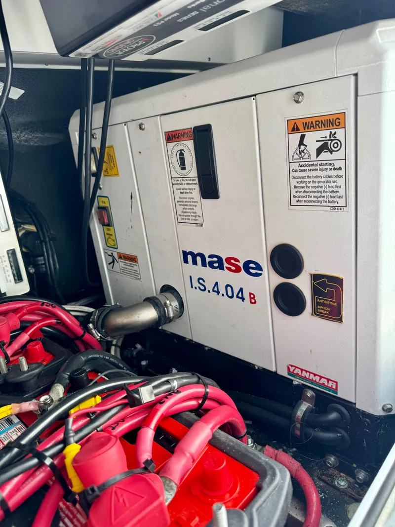 Slide: The Image of Mase I.S.4.04B generator in a 2020 Yellowfin 42 Offshore boat engine compartment. - 28
