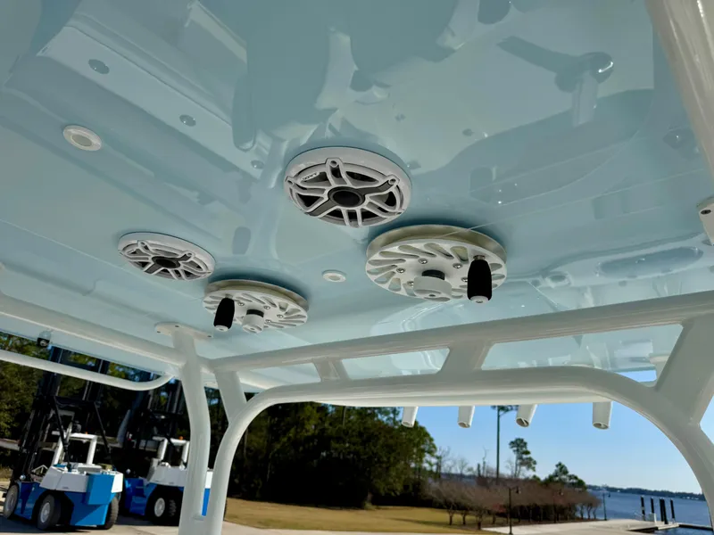 Slide: The Image of 2020 Yellowfin 42 Offshore boat speakers on light blue ceiling, dockside view. - 30