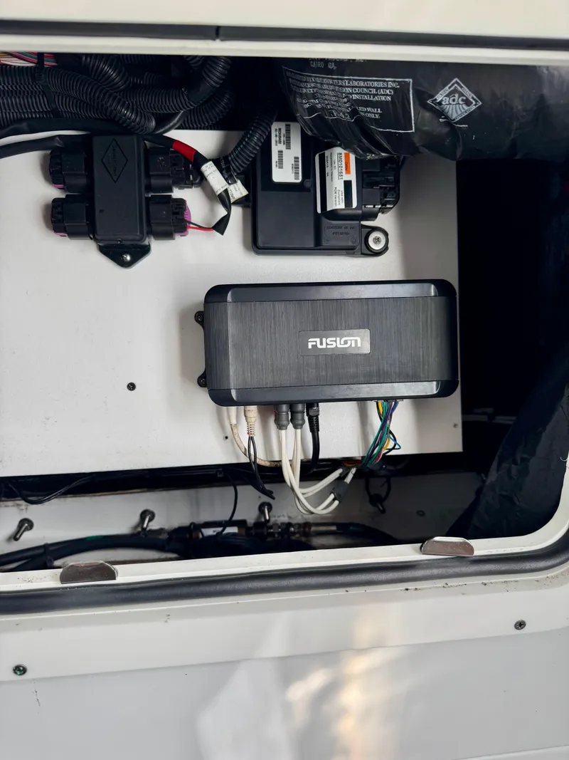 Slide: The Image of Electrical components inside a 2020 Yellowfin 42 Offshore boat compartment. - 35