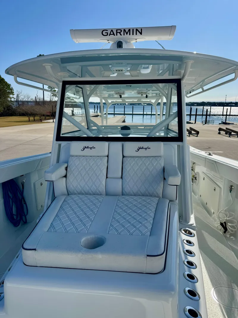 Slide: The Image of 2020 Yellowfin 42 Offshore boat with Garmin equipment, docked near a waterfront. - 42