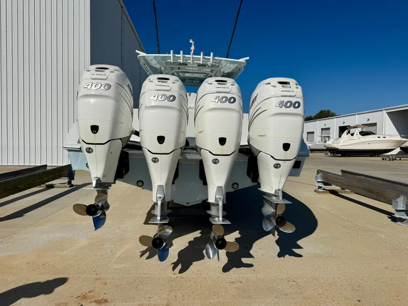 Slide: The Image of 2020 Yellowfin 42 Offshore boat with four 400 horsepower engines, docked outdoors. - 9