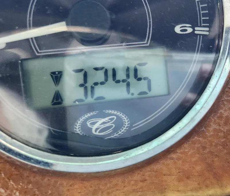 Slide: The Image of Close-up of a 2010 Cobalt 323 gauge displaying 324.5 hours. - 16