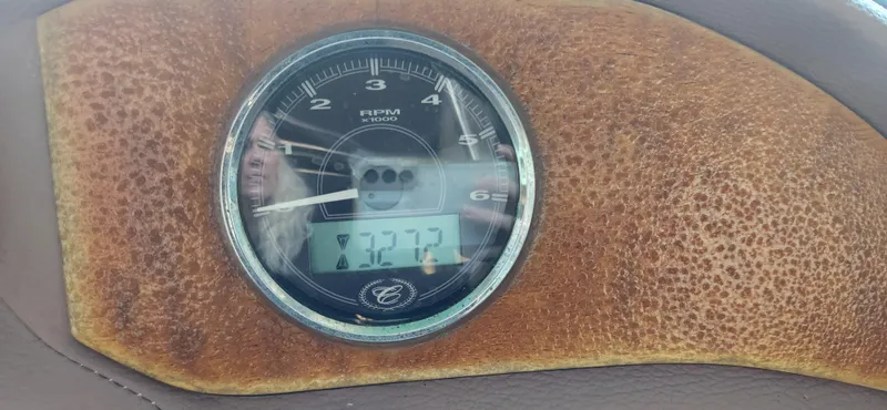Slide: The Image of Tachometer of 2010 Cobalt 323 displaying 7272 RPM on a textured dashboard. - 17