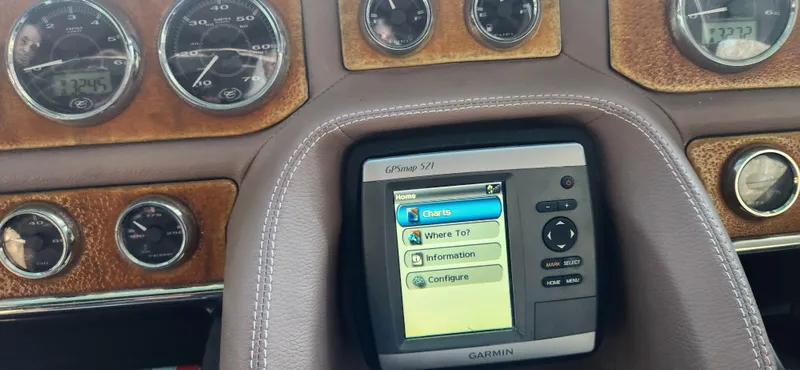 Slide: The Image of Dashboard of a 2010 Cobalt 323 with Garmin GPS and classic gauges. - 18