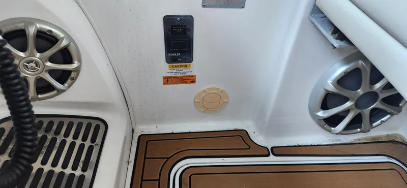 Slide: The Image of Interior of 2010 Cobalt 323 boat with speakers and control panel. - 22