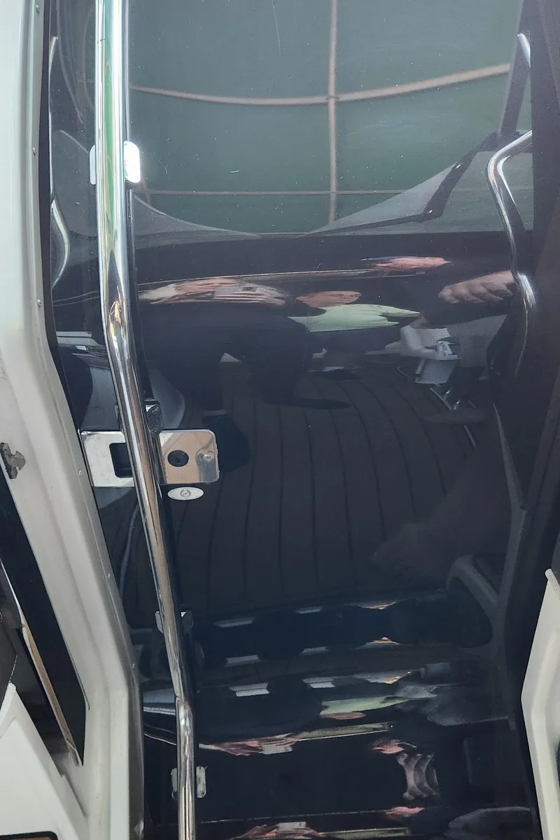 Slide: The Image of 2010 Cobalt 323 boat interior with sleek design and polished surfaces. - 26