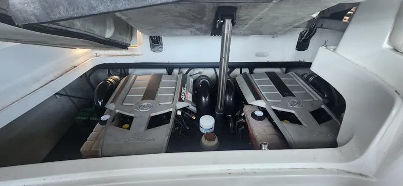 Slide: The Image of Engine compartment of a 2010 Cobalt 323 boat, featuring dual engines. - 38