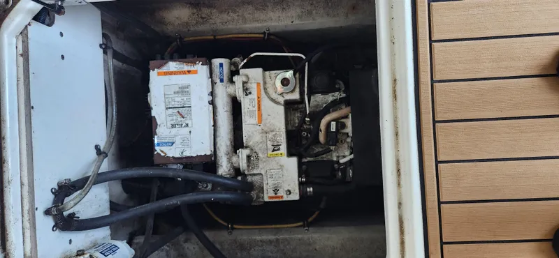 Slide: The Image of Engine compartment of a 2010 Cobalt 323 boat, showing mechanical components and wiring. - 46