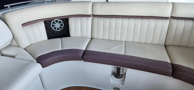 Slide: The Image of Luxurious seating on a 2010 Cobalt 323 boat with elegant upholstery and integrated speaker. - 8