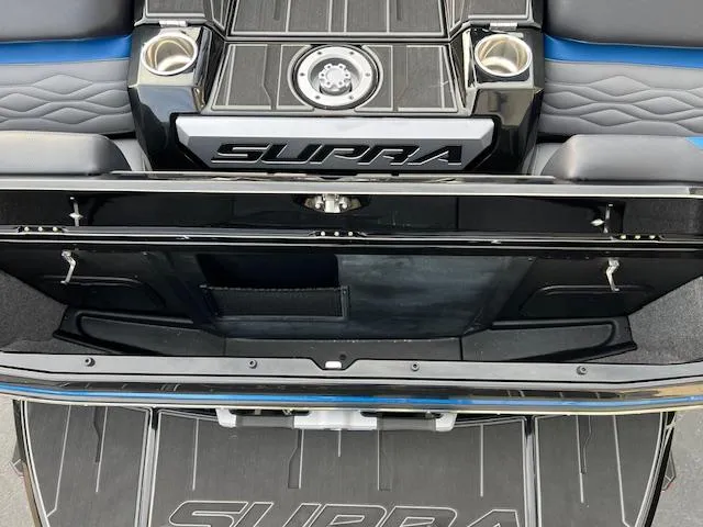Slide: The Image of 2025 Supra SA450 boat interior with sleek design and storage compartments. - 10
