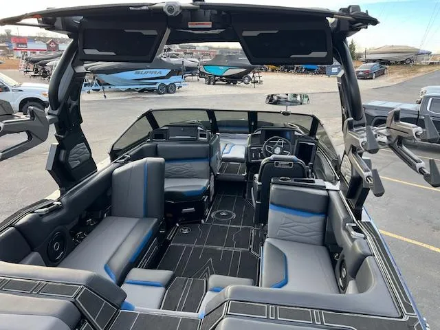 Slide: The Image of 2025 Supra SA450 boat interior with modern seating and sleek design. - 11