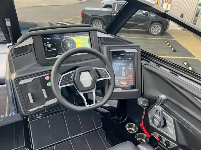 Slide: The Image of 2025 Supra SA450 boat dashboard with advanced digital displays and steering wheel. - 15