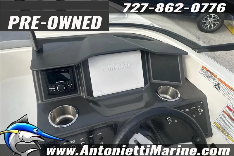 Slide: The Image of Pre-owned 2022 Bayliner VR6 Bowrider OB dashboard with Simrad display and controls. - 9