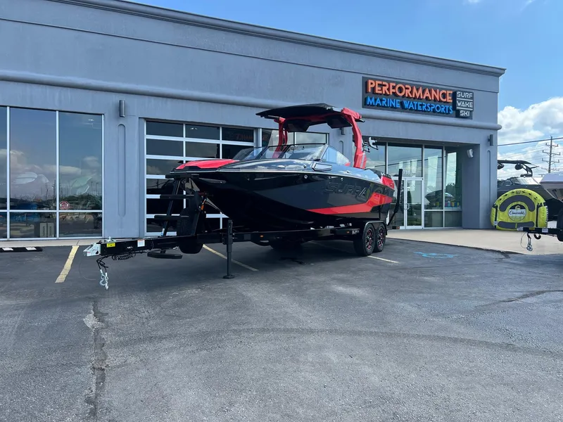 The Image of 2025 Supra SL450 boat displayed at Performance Marine Watersports dealership. - 1
