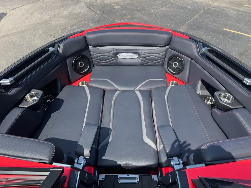 Slide: The Image of 2025 Supra SL450 boat interior with sleek seating and integrated speakers. - 11