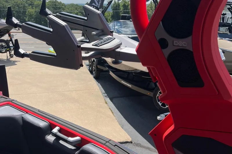 Slide: The Image of 2025 Supra SL450 boat interior with red accents and wakeboard racks. - 15