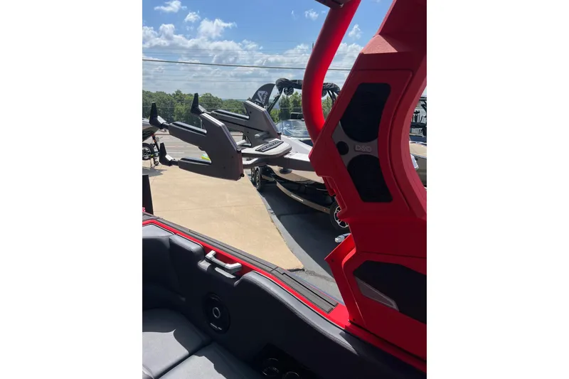 Slide: The Image of 2025 Supra SL 450 interior with red accents and exterior view of boats. - 17