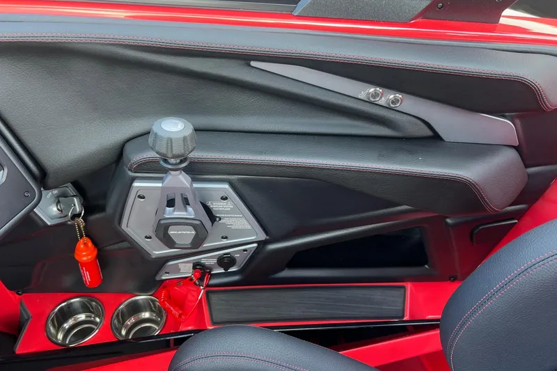 Slide: The Image of 2025 Supra SL 450 interior with sleek design, red accents, and modern controls. - 23