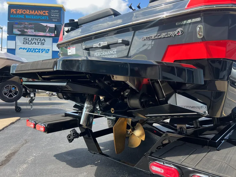 Slide: The Image of 2025 Supra SL450 boat rear view with propeller and swim platform. - 4