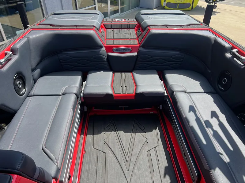 Slide: The Image of 2025 Supra SL450 boat interior with gray and red seating, modern design. - 9