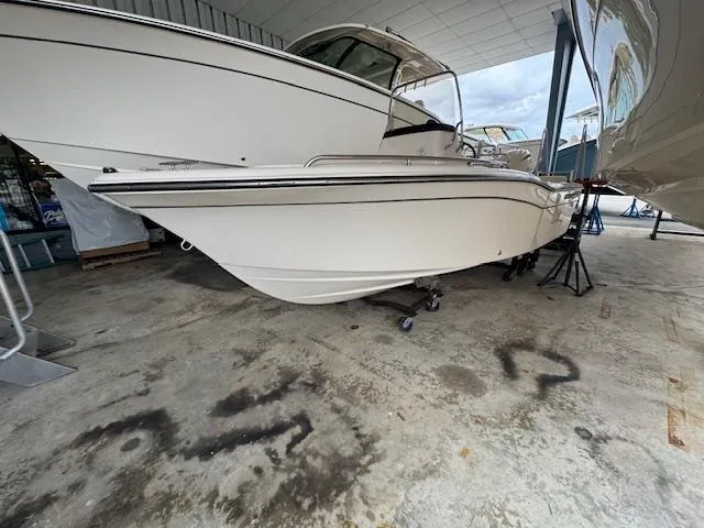 Slide: The Image of 2024 Grady-White Fisherman 180 boat displayed indoors on a concrete floor. - 3