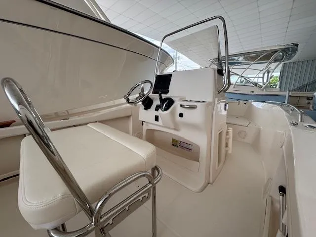 Slide: The Image of 2024 Grady-White Fisherman 180 boat interior with steering console and seating. - 6