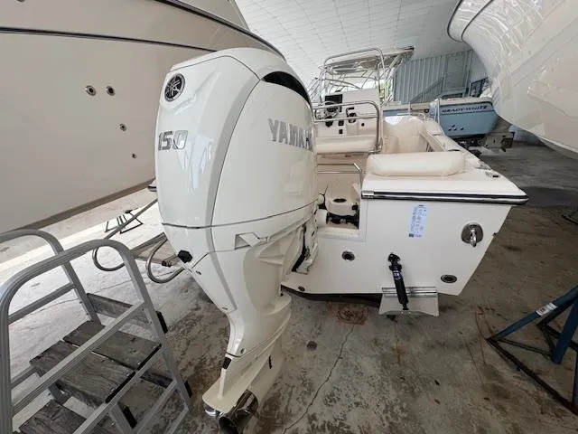 Slide: The Image of 2024 Grady-White Fisherman 180 boat with Yamaha 150 outboard motor in a showroom. - 8