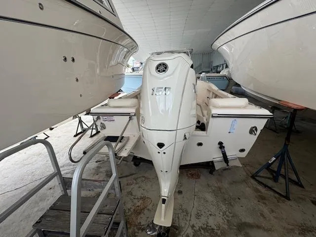 Slide: The Image of 2024 Grady-White Fisherman 180 boat with 150 HP engine in storage. - 9