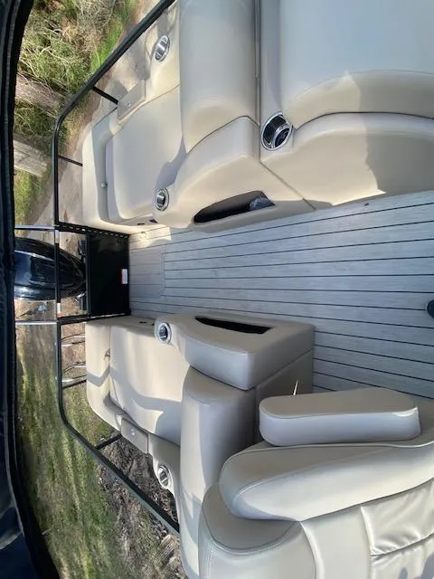 Slide: The Image of 2023 SunCatcher Fusion 324SS interior with beige seating and sleek design. - 31