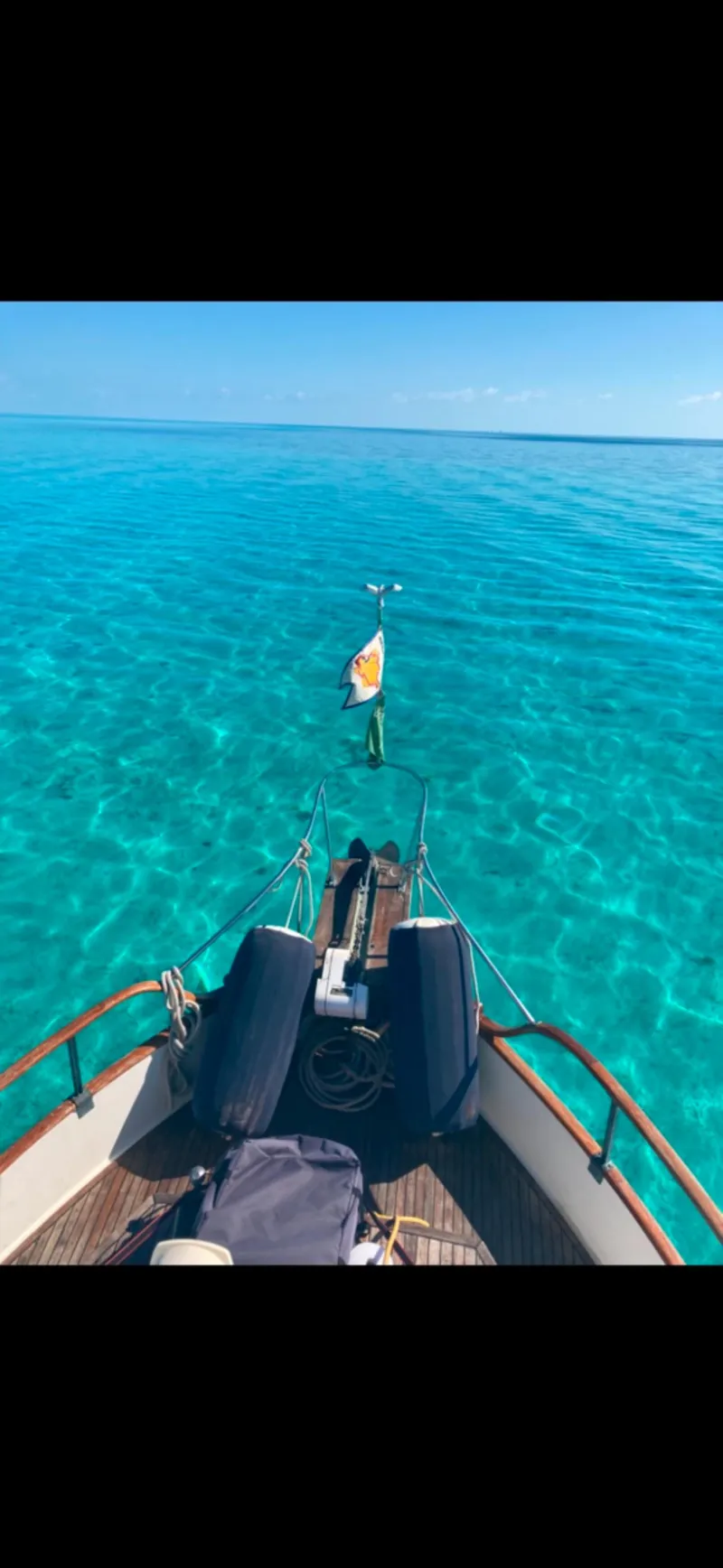 Slide: The Image of 1982 Grand Banks 36 Classic on clear turquoise water, sunny day, calm sea. - 22