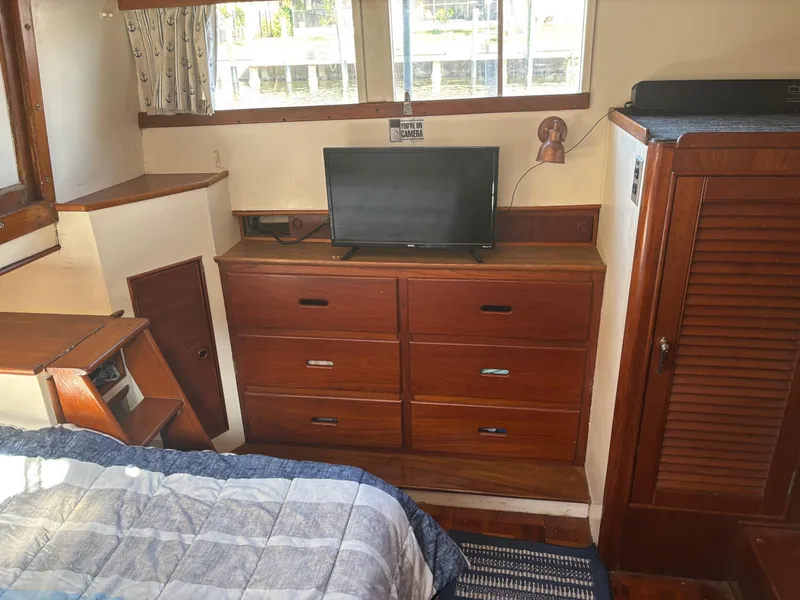 Slide: The Image of Interior of 1982 Grand Banks 36 Classic with TV and wooden drawers. - 23