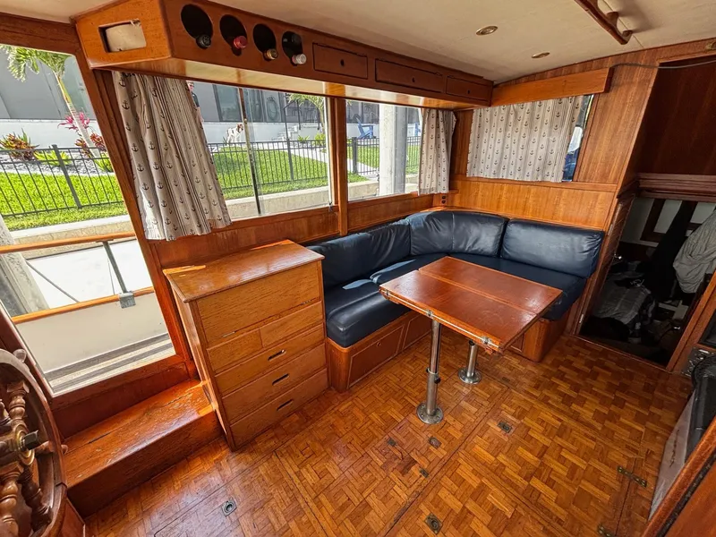 Slide: The Image of Interior of 1982 Grand Banks 36 Classic with wood finish and blue seating. - 29