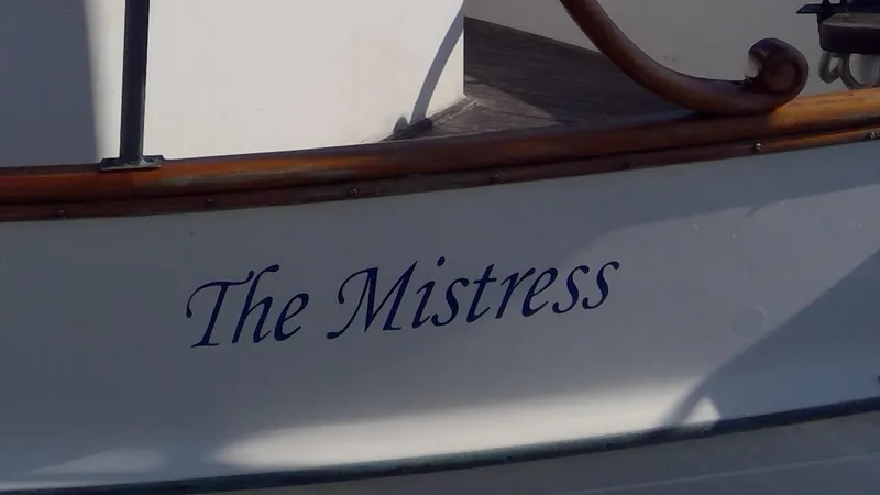 Slide: The Image of 1982 Grand Banks 36 Classic boat named "The Mistress" with wooden trim detail. - 3