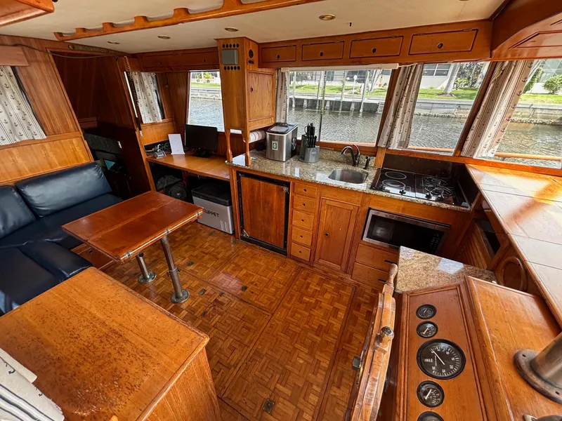 Slide: The Image of Interior of 1982 Grand Banks 36 Classic yacht with wood finish and kitchen amenities. - 30