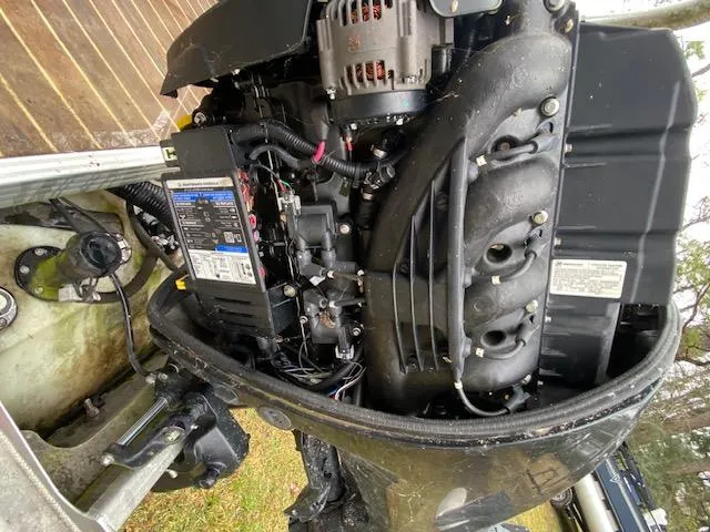 Slide: The Image of Close-up of a 2020 Crest Classic DLX 240 SLC boat engine components. - 22