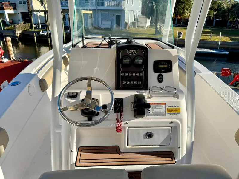 Slide: The Image of 2018 Sea Fox 226 Commander boat console with steering wheel and control panel. - 10