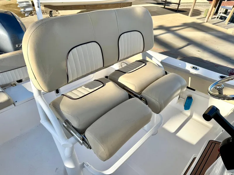 Slide: The Image of 2018 Sea Fox 226 Commander boat seats, beige upholstery, dual seating arrangement. - 17