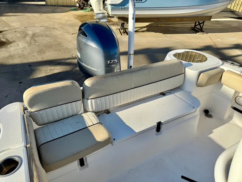 Slide: The Image of 2018 Sea Fox 226 Commander boat interior with seating and Yamaha 175 outboard motor. - 18