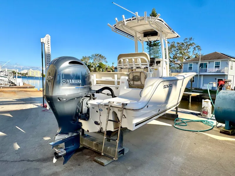 Slide: The Image of 2018 Sea Fox 226 Commander boat with Yamaha engine, docked near waterfront homes. - 20