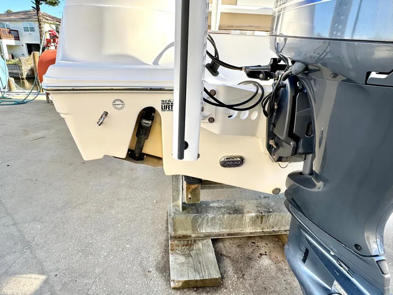 Slide: The Image of 2018 Sea Fox 226 Commander boat with outboard motor on a stand. - 21