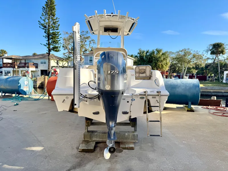 Slide: The Image of 2018 Sea Fox 226 Commander boat with 175 HP engine, docked outdoors. - 23