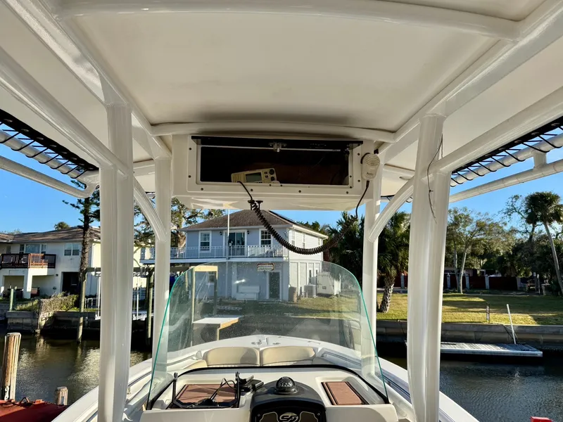 Slide: The Image of 2018 Sea Fox 226 Commander boat interior with console and waterfront view. - 6