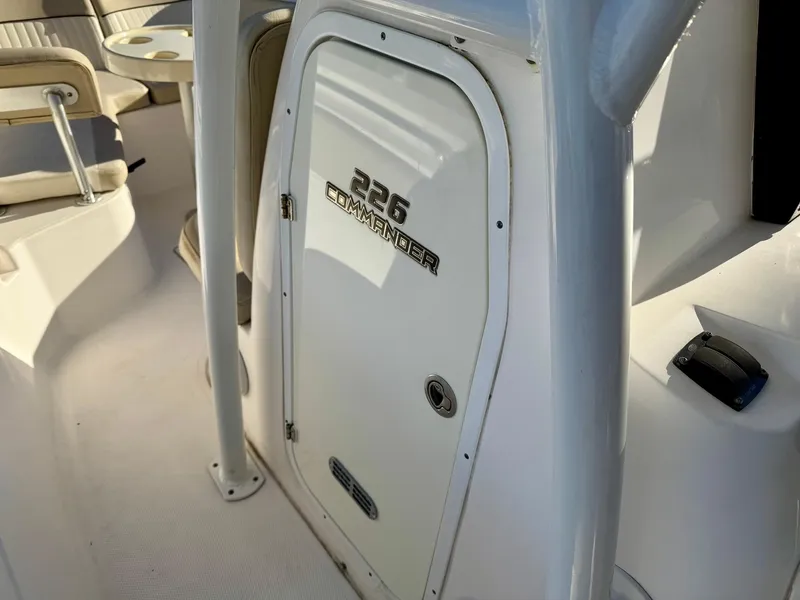 Slide: The Image of 2018 Sea Fox 226 Commander boat interior, featuring a white cabin door. - 7