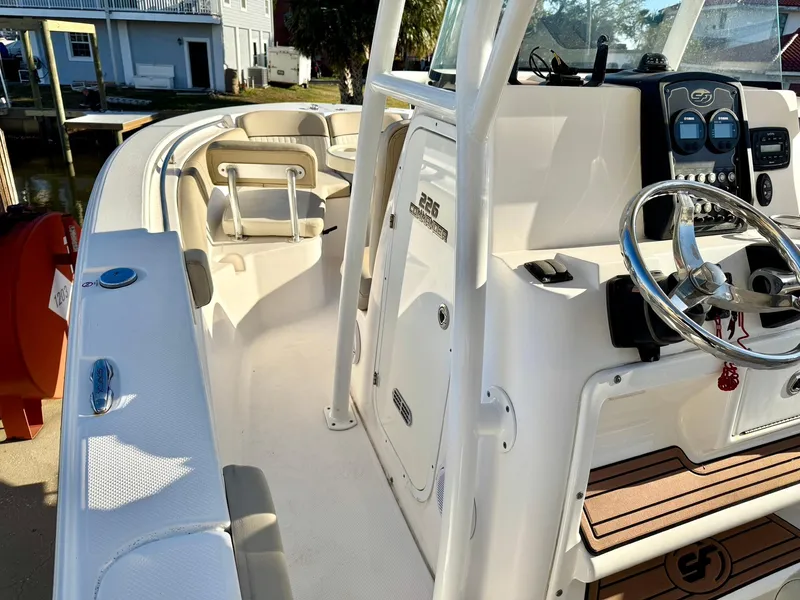 Slide: The Image of 2018 Sea Fox 226 Commander boat interior with steering wheel and seating area. - 8