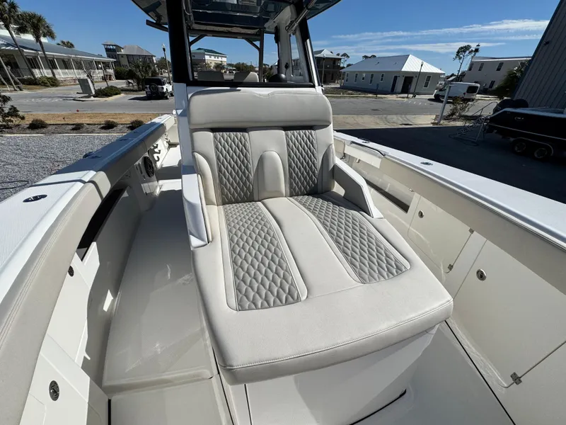 Slide: The Image of Luxurious seating on 2025 Solace 32 CS boat, featuring elegant diamond-pattern upholstery. - 31