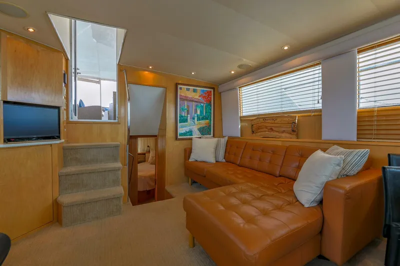 Slide: The Image of Luxurious interior of 1998 Hatteras 52 Sport Deck Motor Yacht with leather seating and modern decor. - 1