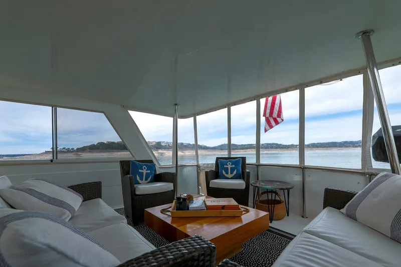 Slide: The Image of Interior of 1998 Hatteras 52 Sport Deck Motor Yacht with comfortable seating and scenic view. - 16