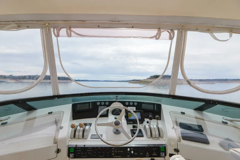 Slide: The Image of 1998 Hatteras 52 Sport Deck Motor Yacht helm with panoramic water view. - 19