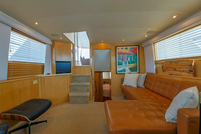 Slide: The Image of Luxurious interior of 1998 Hatteras 52 Sport Deck Motor Yacht with leather seating and modern decor. - 2
