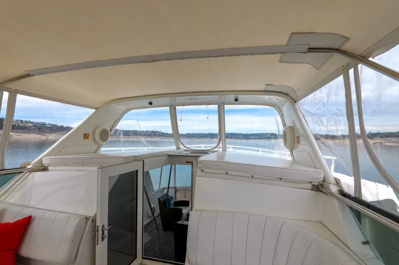 Slide: The Image of 1998 Hatteras 52 Sport Deck Motor Yacht interior with panoramic water views. - 21